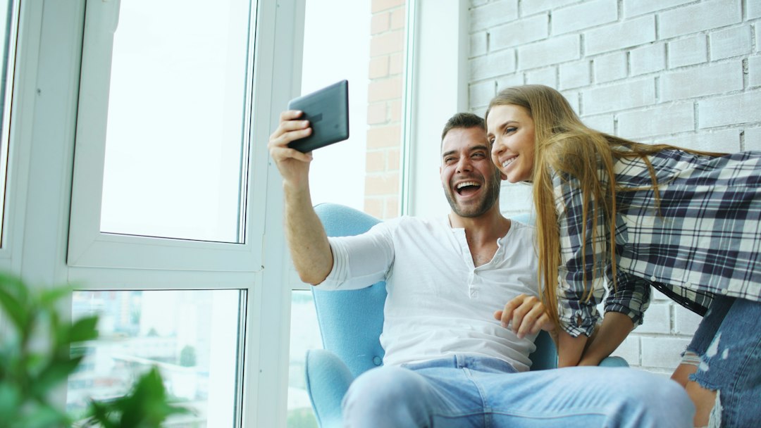 A couple smiling together while taking a photo